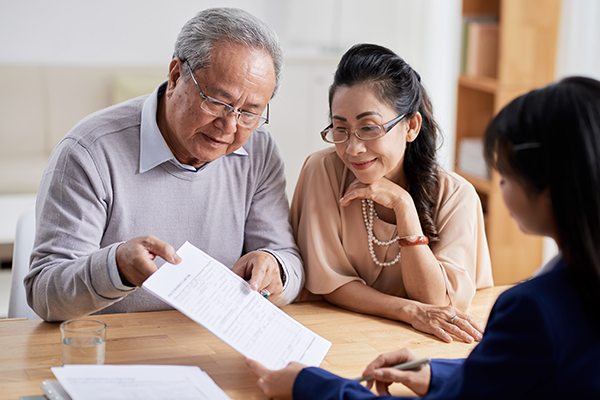 older couple reviewing a contract