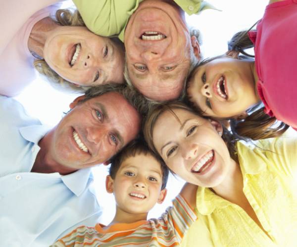 smiling family in a circle 
